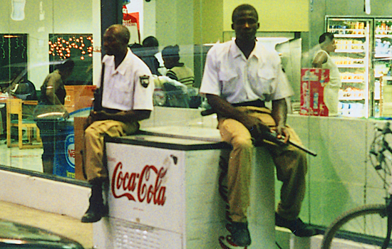 Armed guards protect businesses in Haiti.