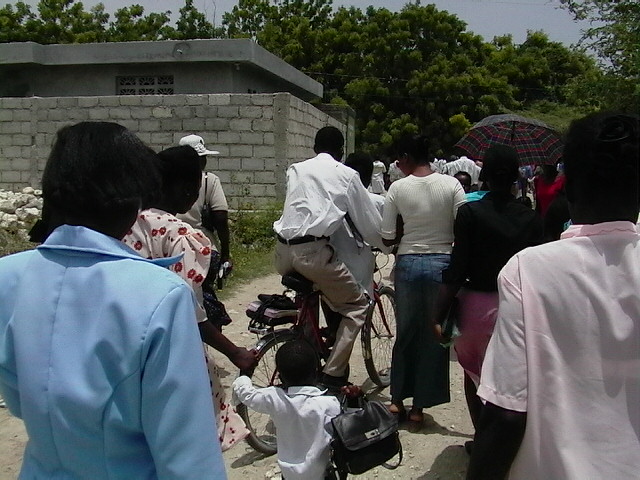 Walking down a dirt road to the church.