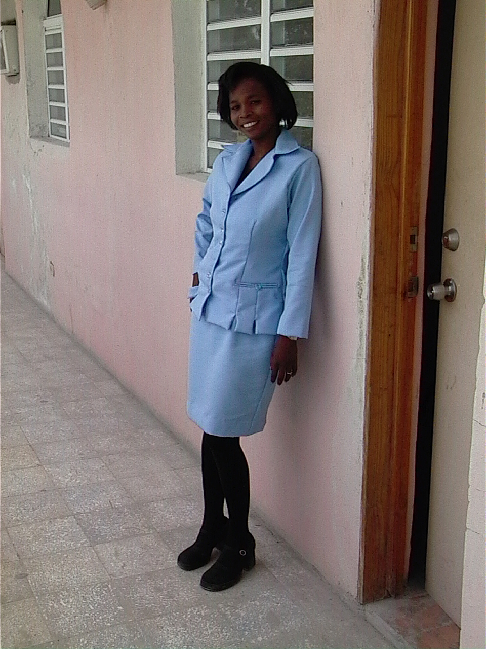 Walking down a dirt road to the church.