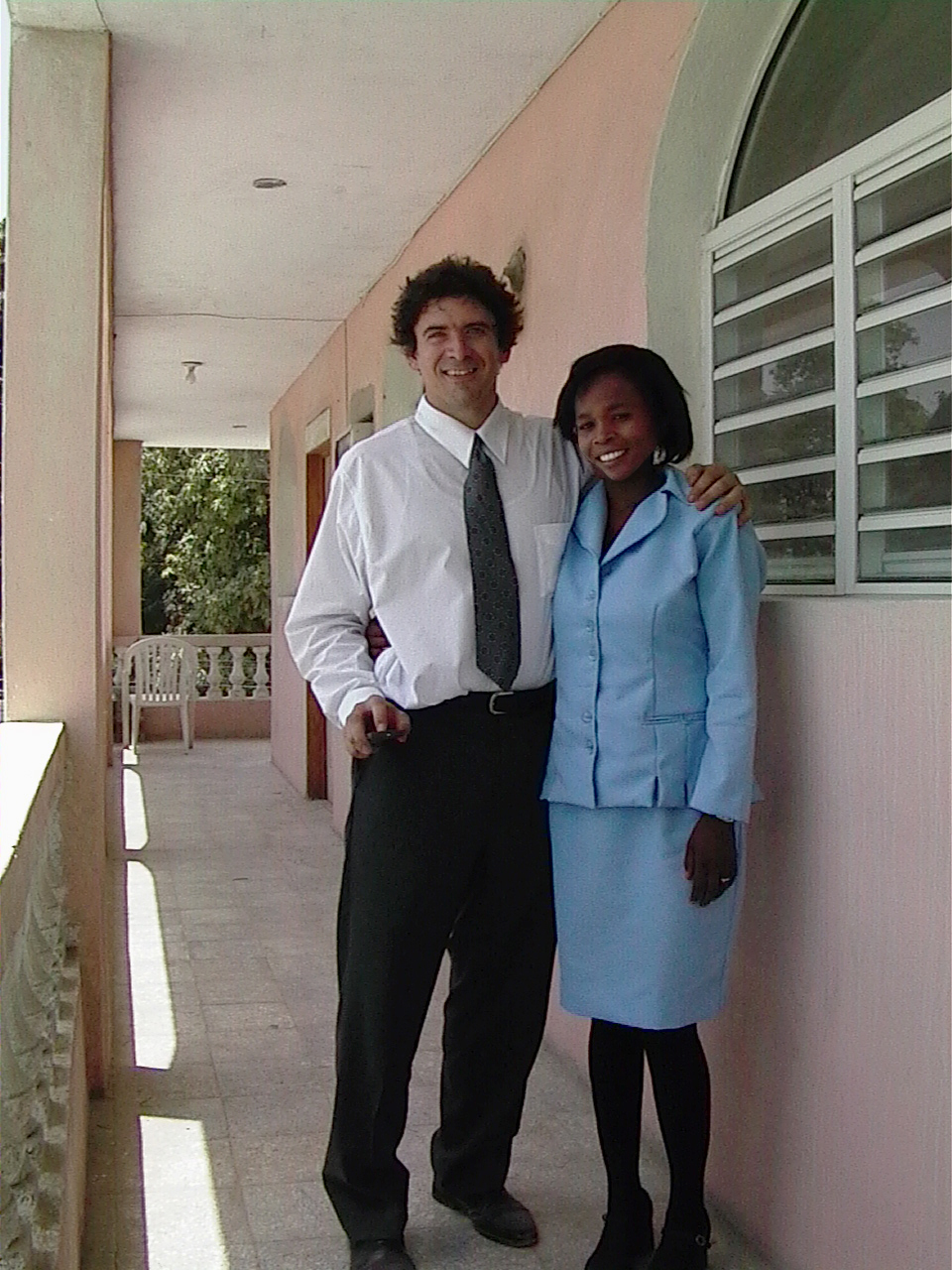 Walking down a dirt road to the church.